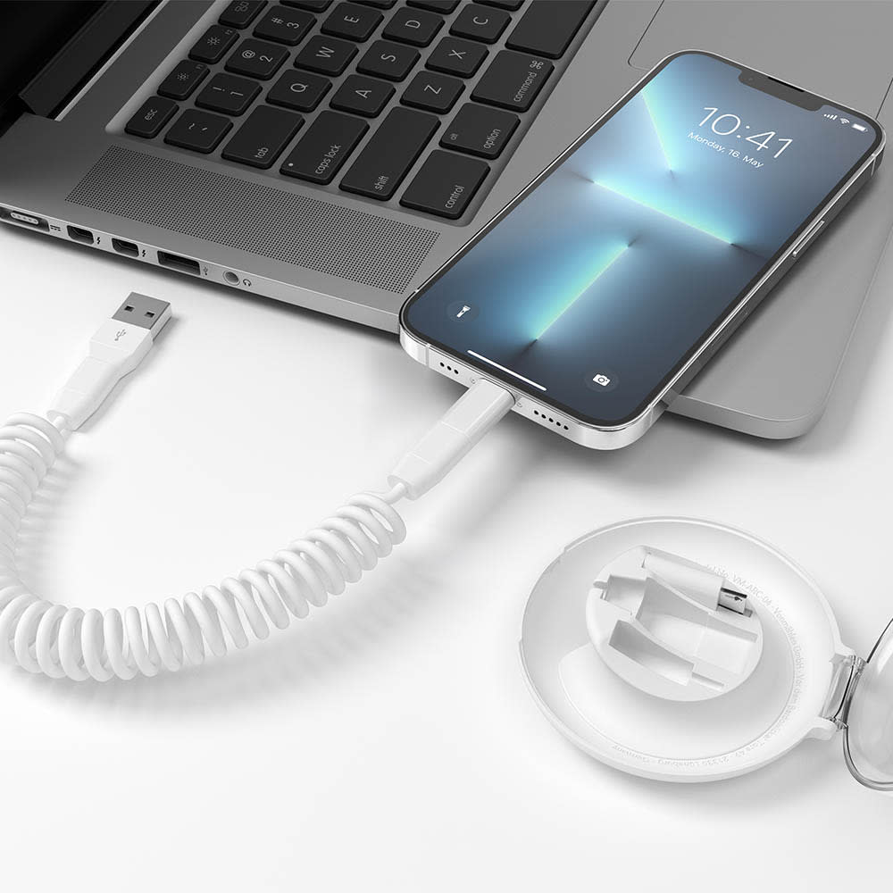 A white eco-friendly 6-in-1 fast charging cable connected to a smartphone and an organiser.