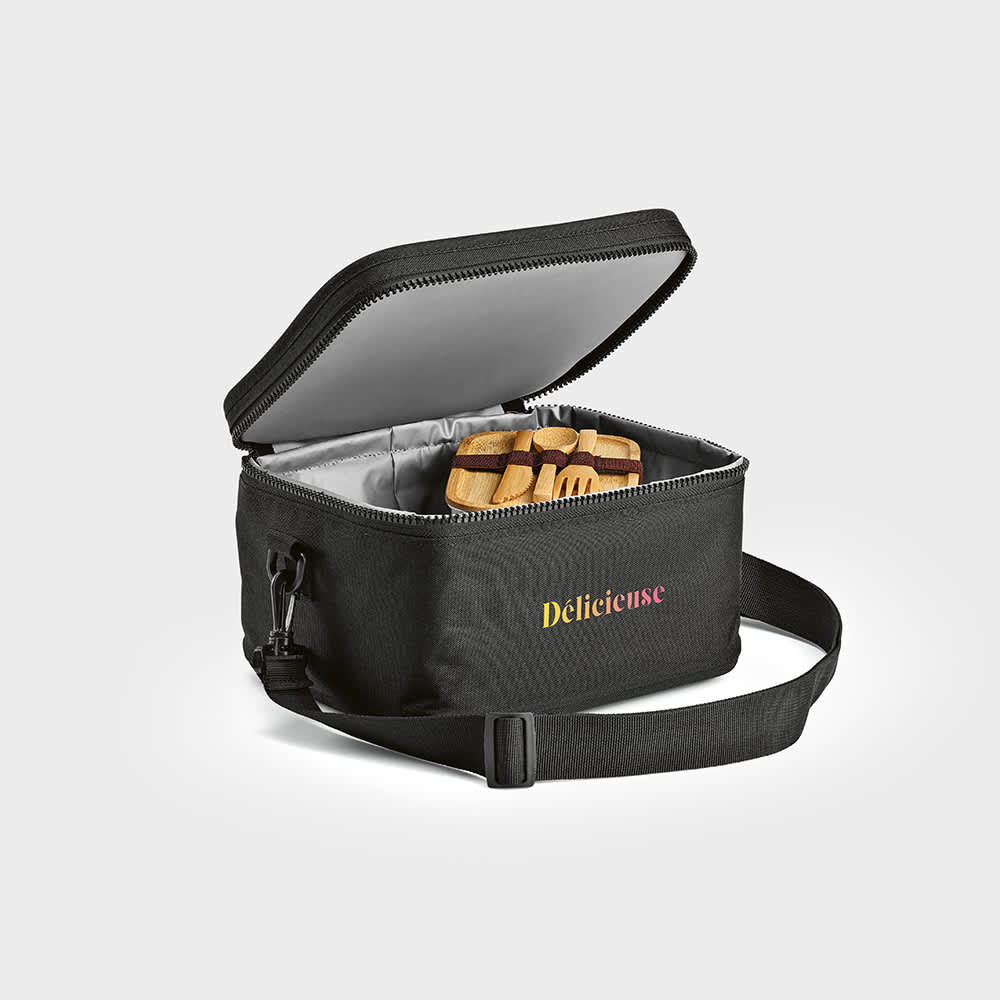 A black cooler bag with a zippered top, featuring a handle and an insulated interior. It contains wooden utensils.