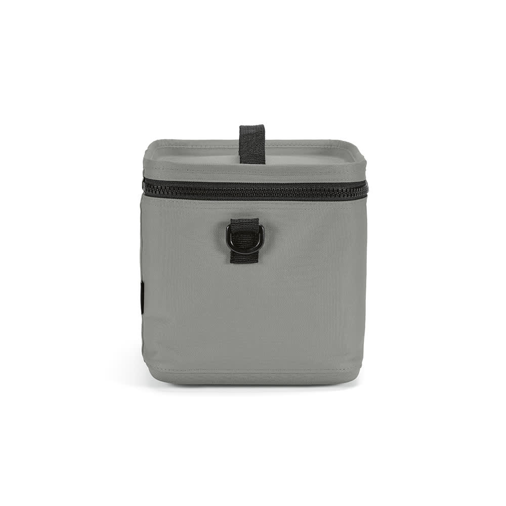 A grey cooler with a square shape, featuring thermo-injected zippers and a front loop for attachment.