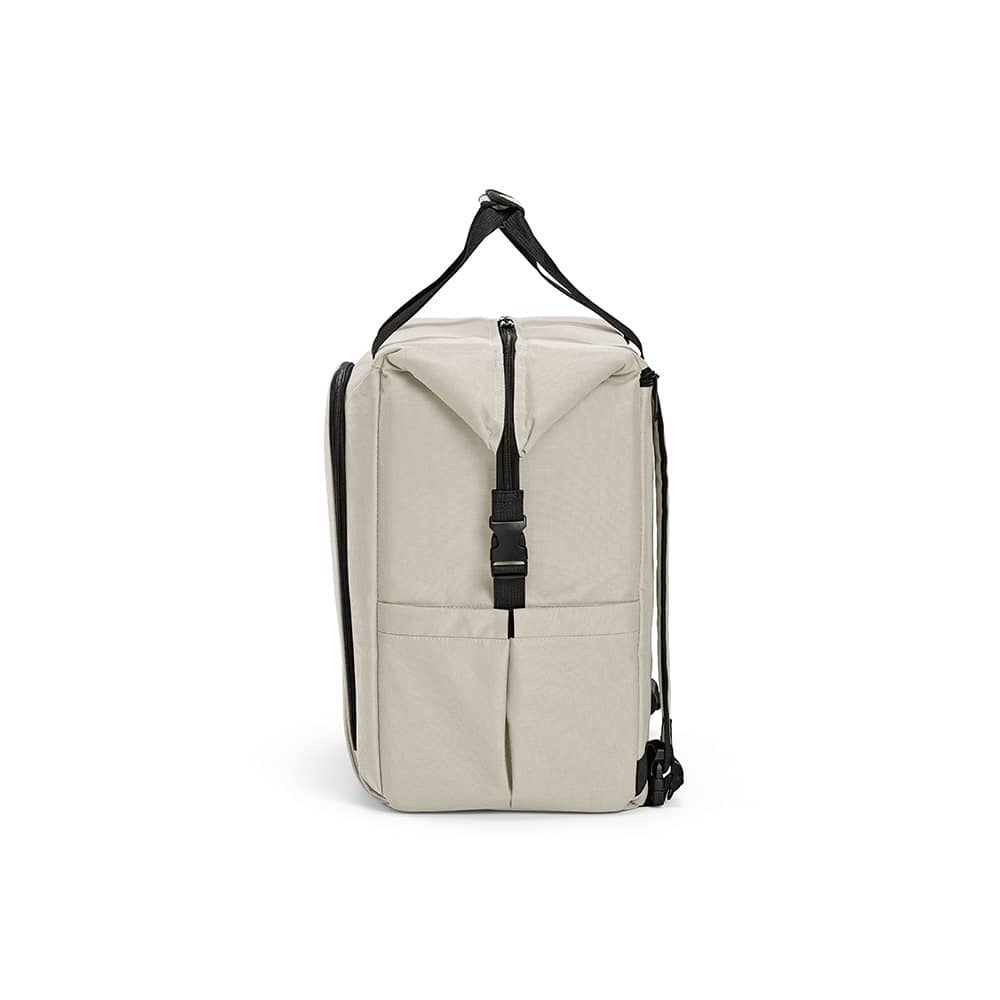 A light grey cooler bag with a zippered top, front pocket, and two side pockets. It has a shoulder strap and a logo.