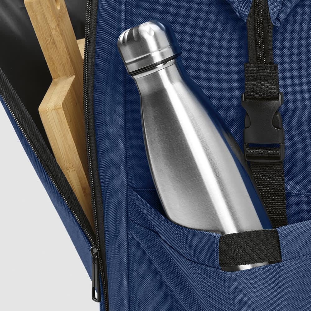 A blue backpack with a stainless steel drink bottle and wooden items visible in side pockets. Features a logo.