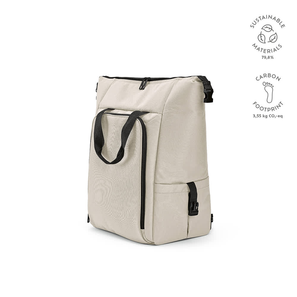 A beige cooler bag featuring a front pocket, two side pockets, and a logo. Made from sustainable materials.