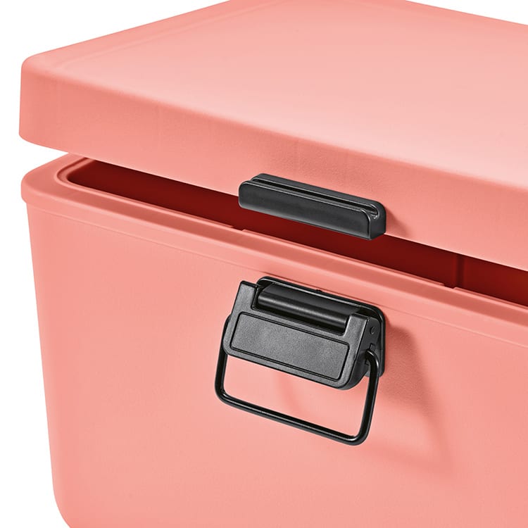 A drink cooler in pastel pink with a black handle and a lid partially open. Features a branding logo.