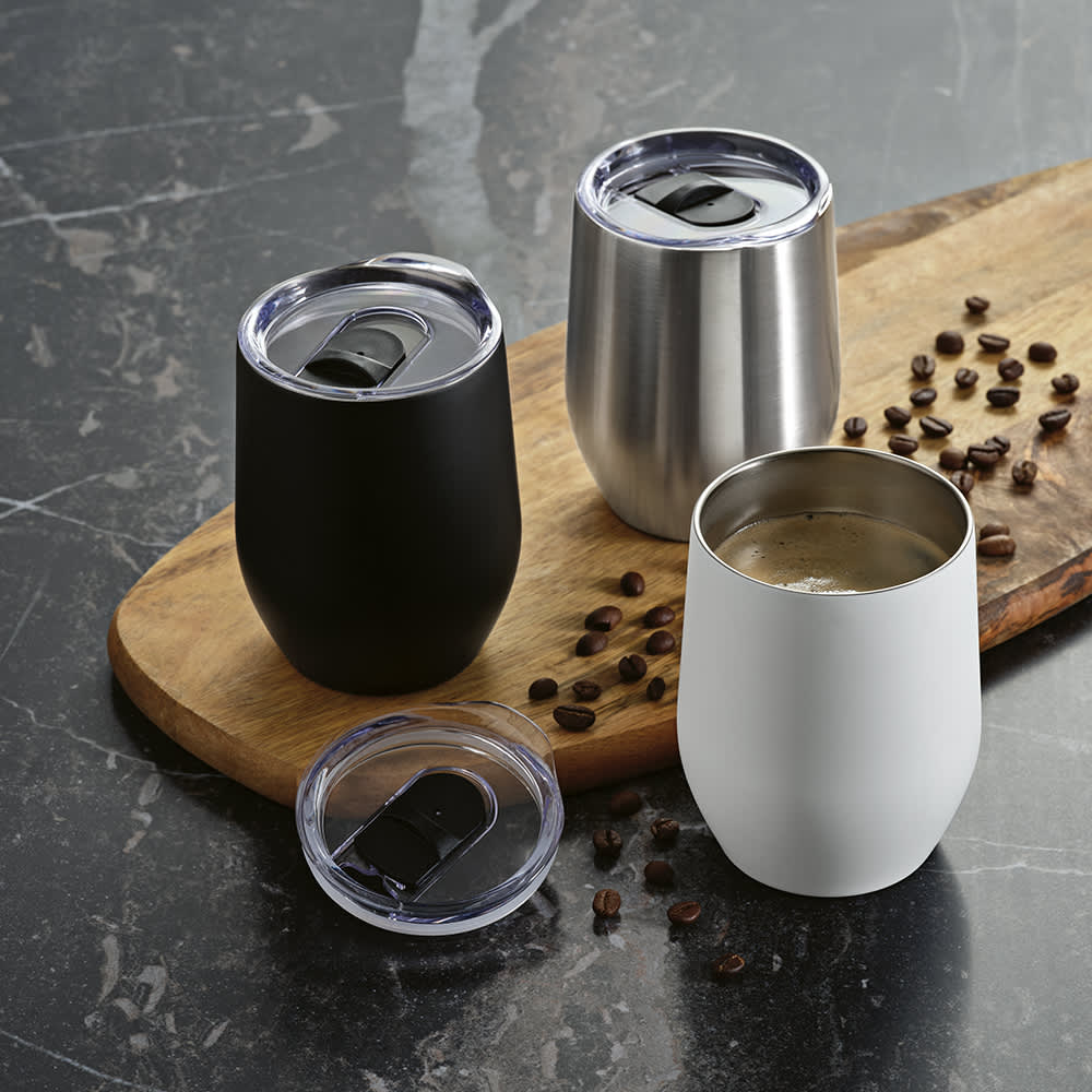 A drink bottle set featuring three stainless steel travel cups in black, silver, and white, with clear lids, displayed on a wooden surface.