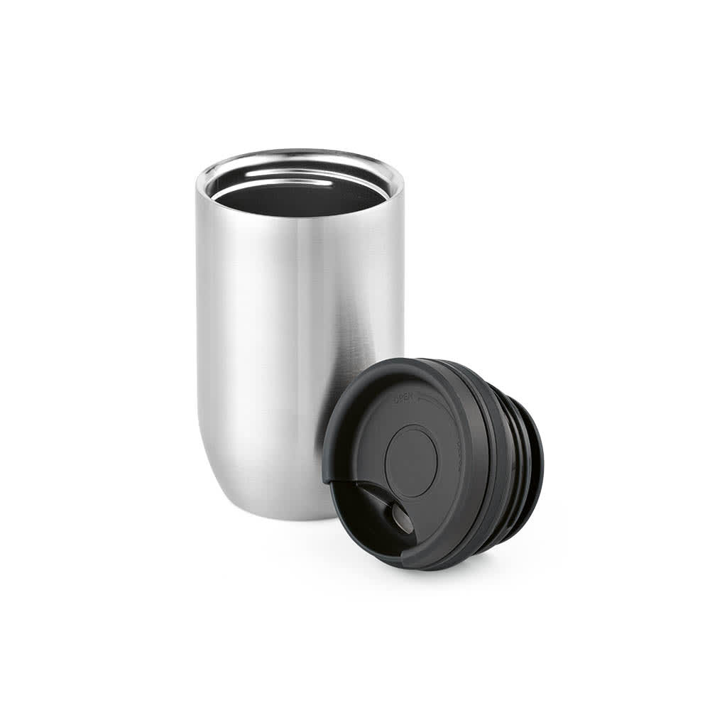 A stainless steel double wall travel cup in silver with a black leakproof lid, featuring a sleek design.