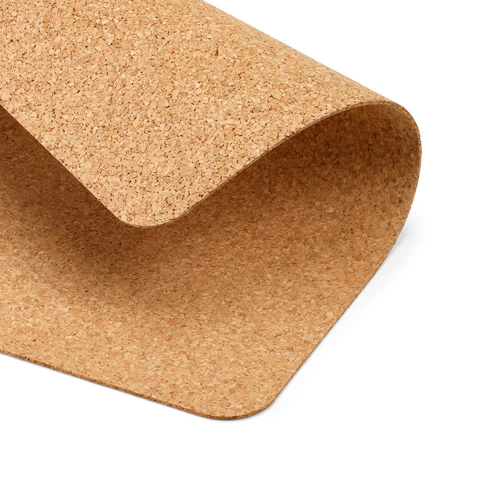 A cork desk mat in a natural beige tone, showcasing its textured surface and curved edges. Features a branding logo.