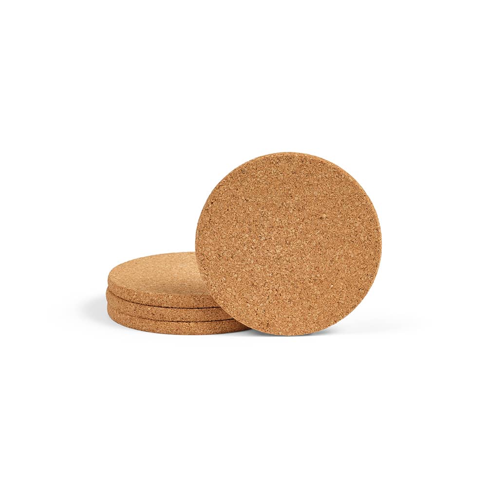 A set of four round cork coasters in a natural brown hue, stacked together.