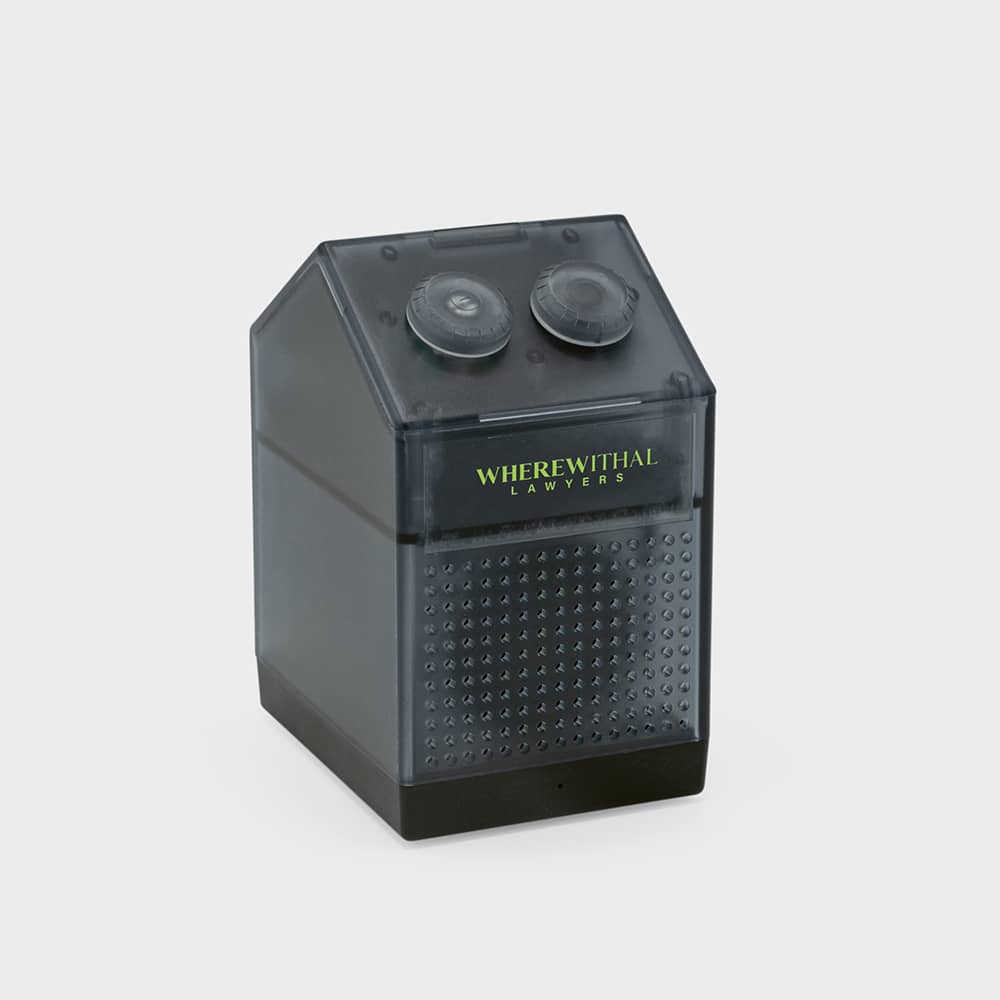 A grey and black pencil sharpener with a unique house-shaped design and a logo on the front.