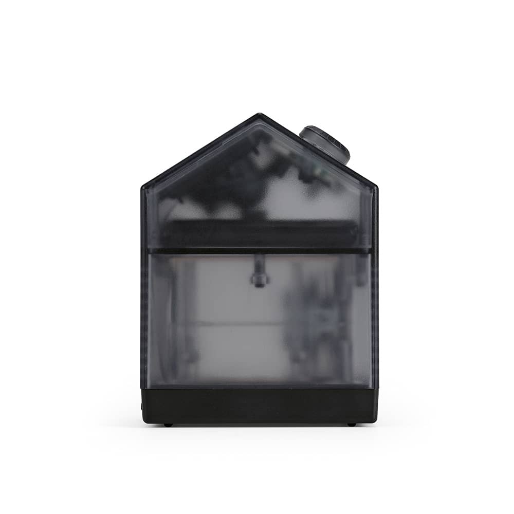 A grey and black product with a house-shaped design, featuring a transparent front and a round top knob.