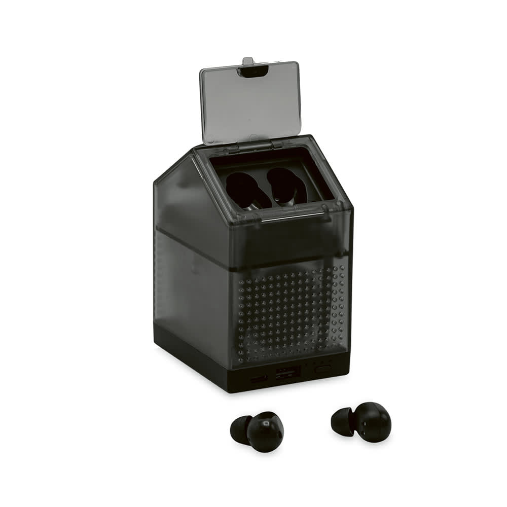 A black 3-in-1 charging case with wireless earbuds and speaker, featuring a transparent lid and branding on the case.