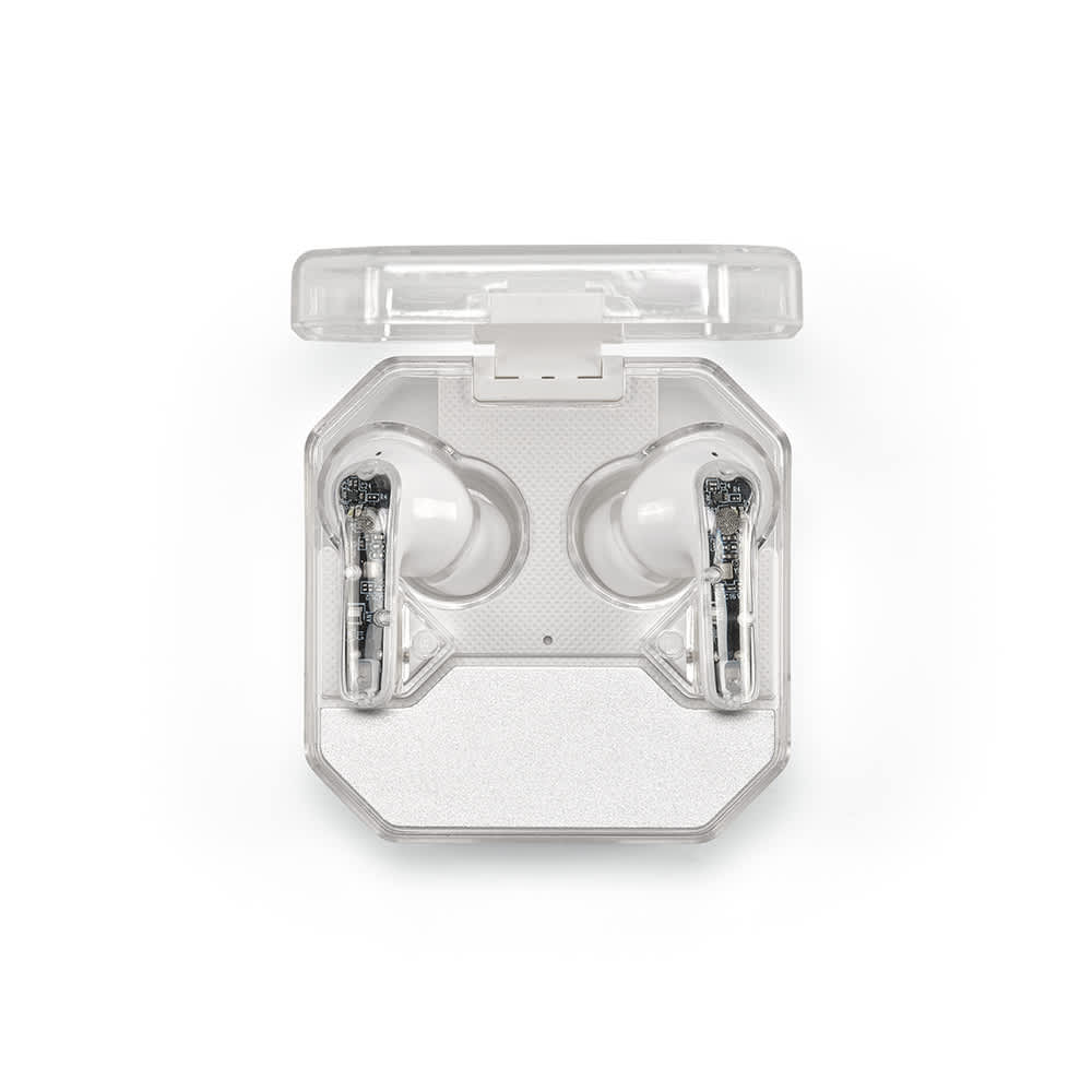 Transparent case containing white Ghostbuds earbuds, displaying an intricate internal design. The case has a logo on it.