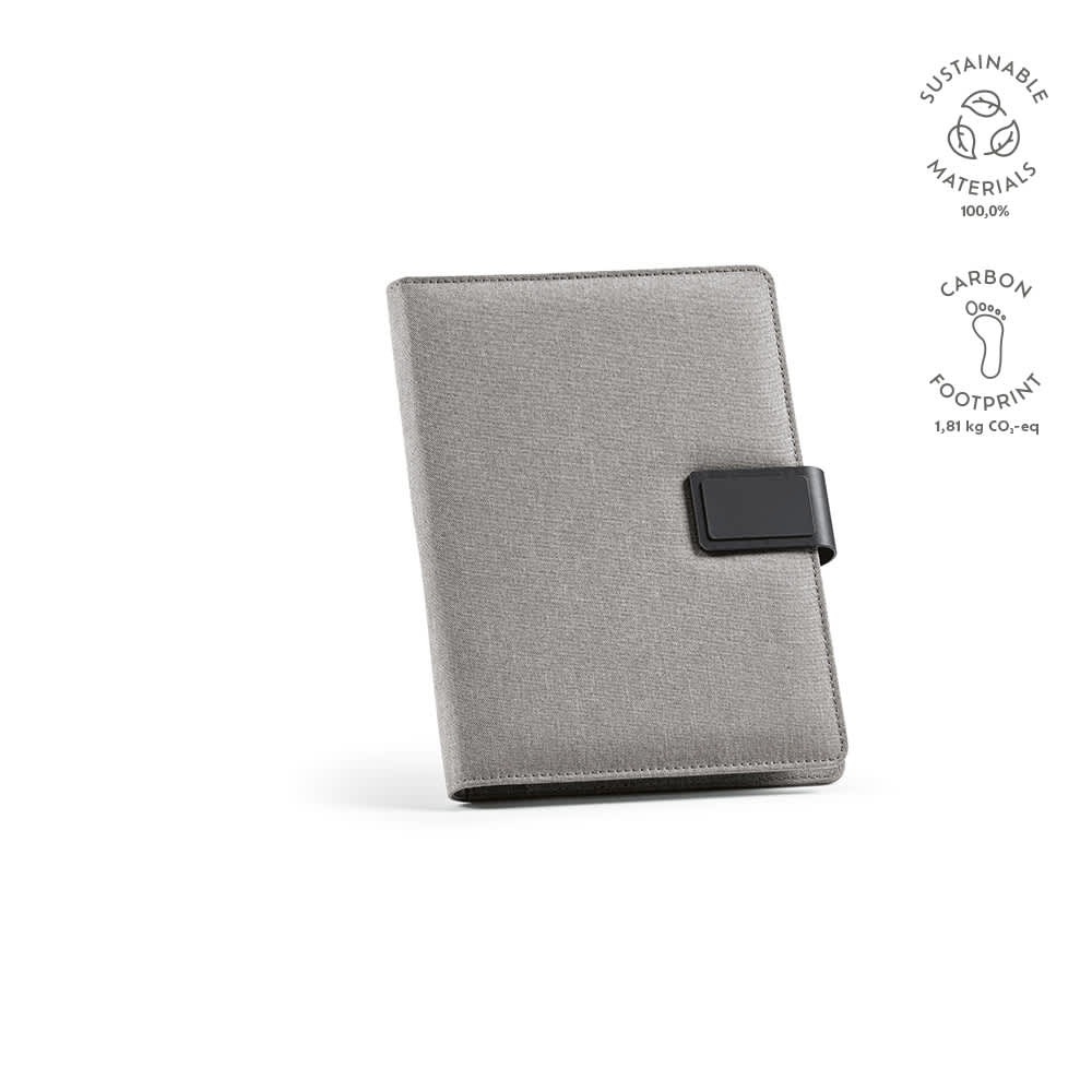 A grey A5 folder made from sustainable materials with a rPU closure and an interior notepad. Features a logo.