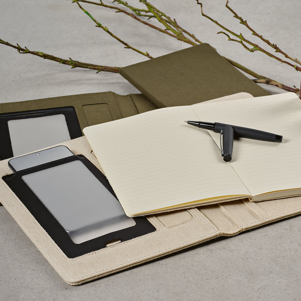 An olive green A4 folder with a notepad, a pen, and compartments for a phone and other items. It has a branding logo.
