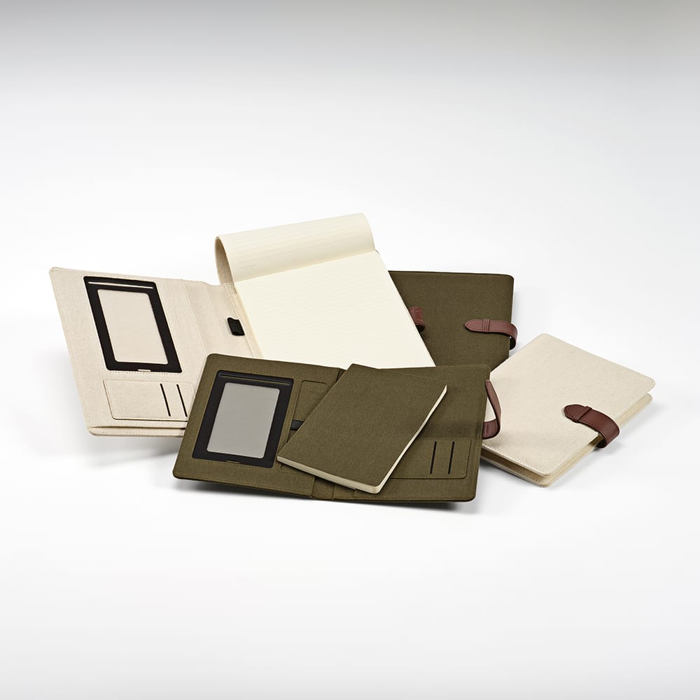 An olive green and cream folder with a notepad, elastic closures, and pockets for cards and documents.