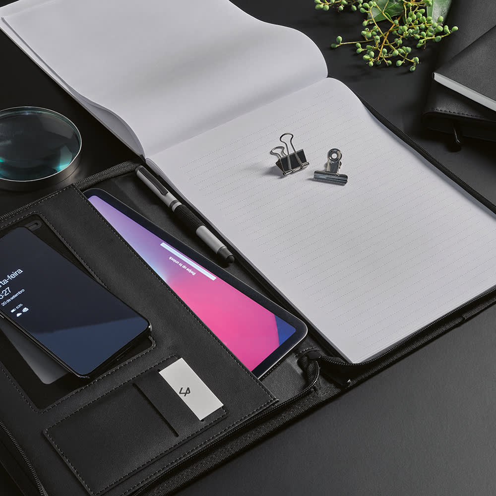 A black A4 folder with a zipper closure, featuring a notepad, phone, pen, and paper clips inside.