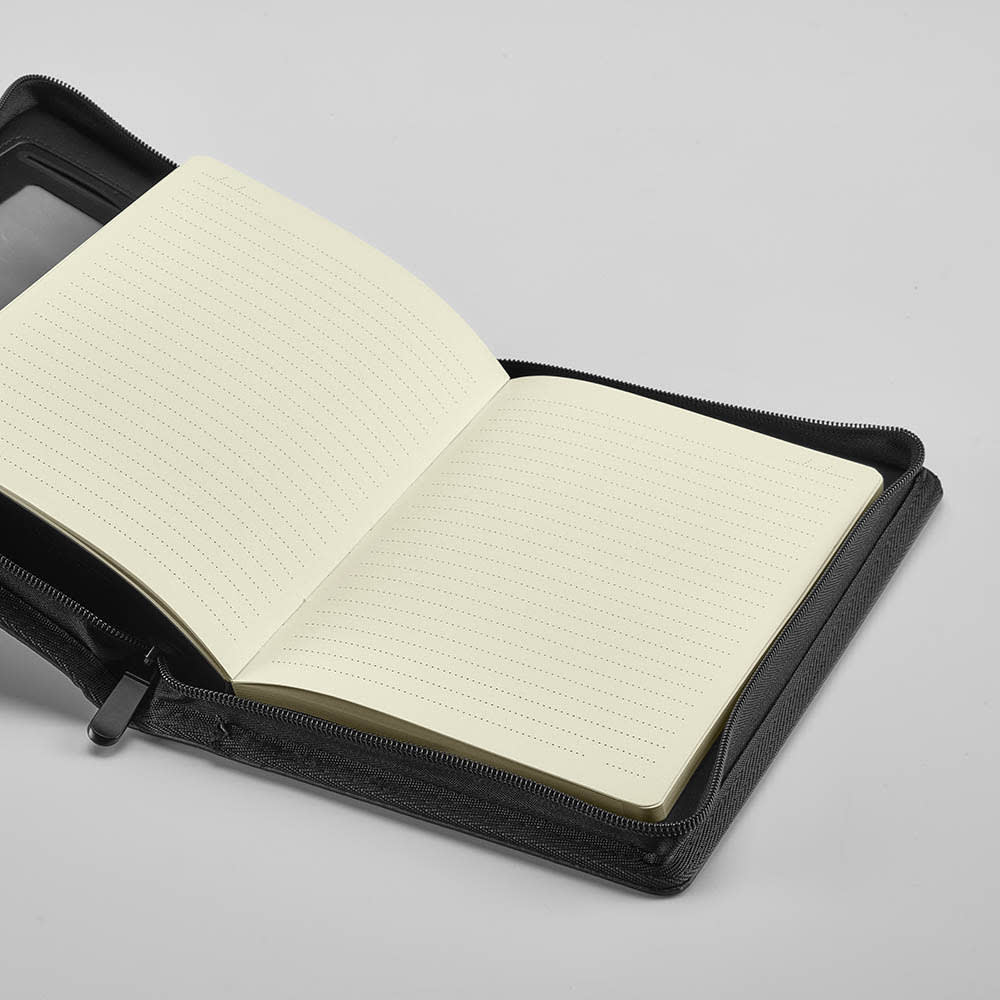 A black zipped folder featuring a lined notepad with cream pages inside. Includes a pocket for storage.