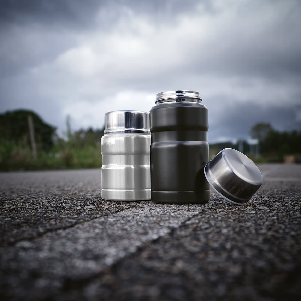 A drink bottle set featuring a silver and a black food flask, each with a metallic finish and a foldable spoon.
