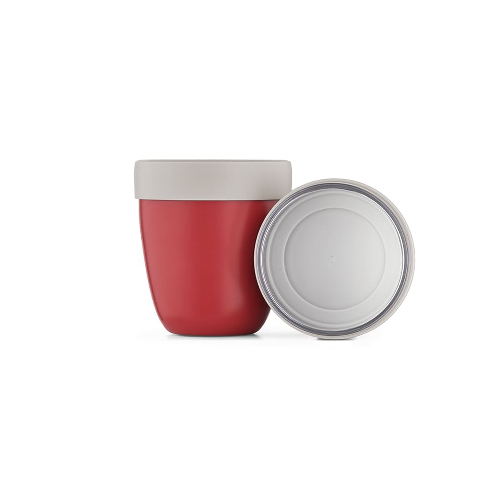 A drink bottle in red with a grey lid, featuring a two-compartment design and a smooth inner base.