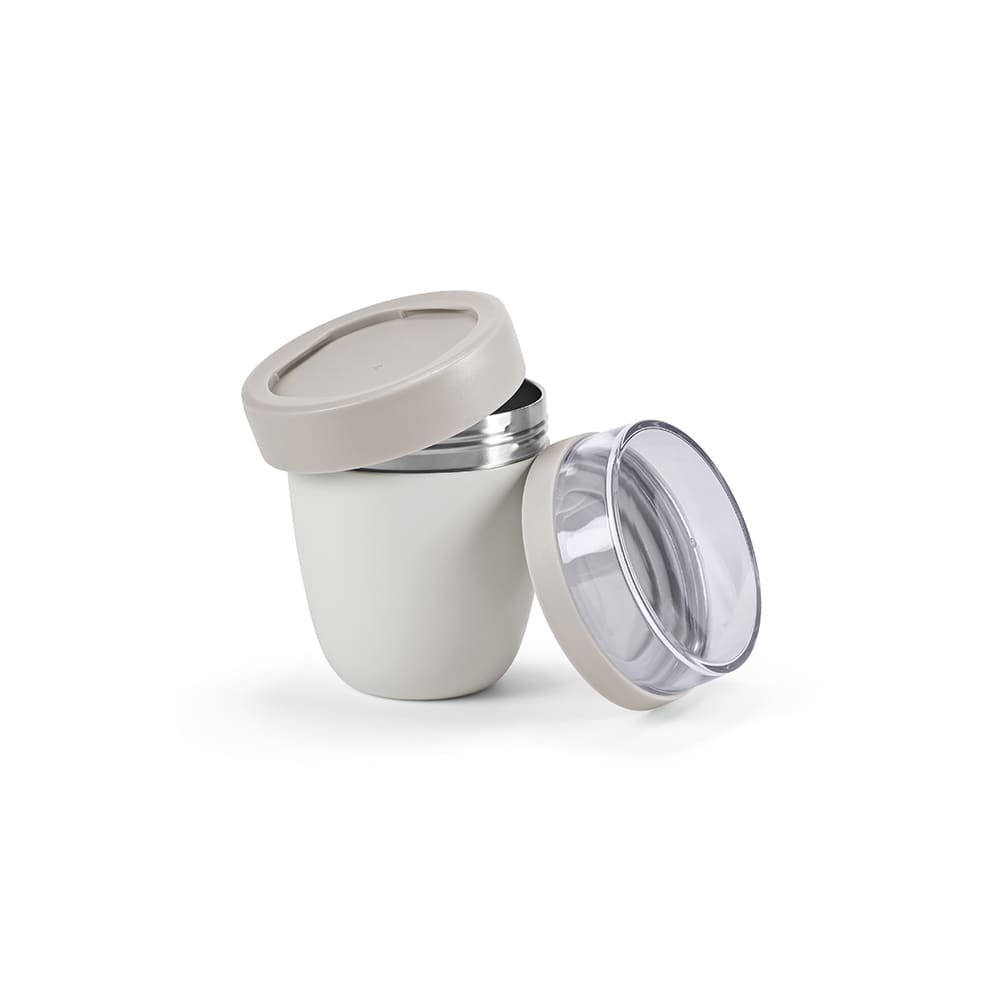A food flask in cream and light brown, featuring two compartments with a clear lid and a stainless steel interior.