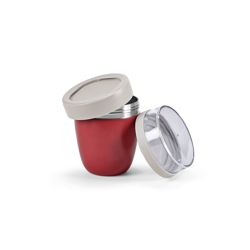 A drink bottle with a red body and grey lid, featuring two compartments for food storage. Includes a transparent lid.
