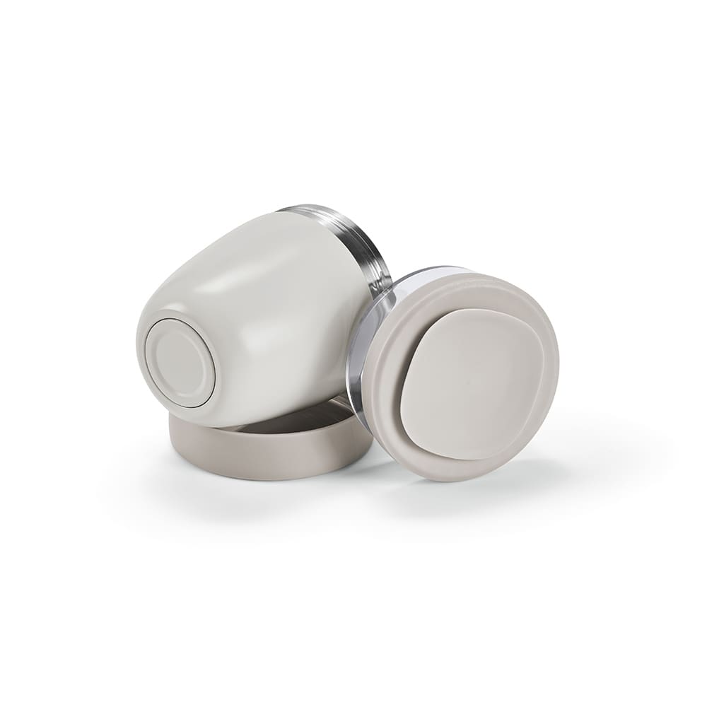 A food flask with a cream exterior and grey lid, featuring two compartments and a branding logo.