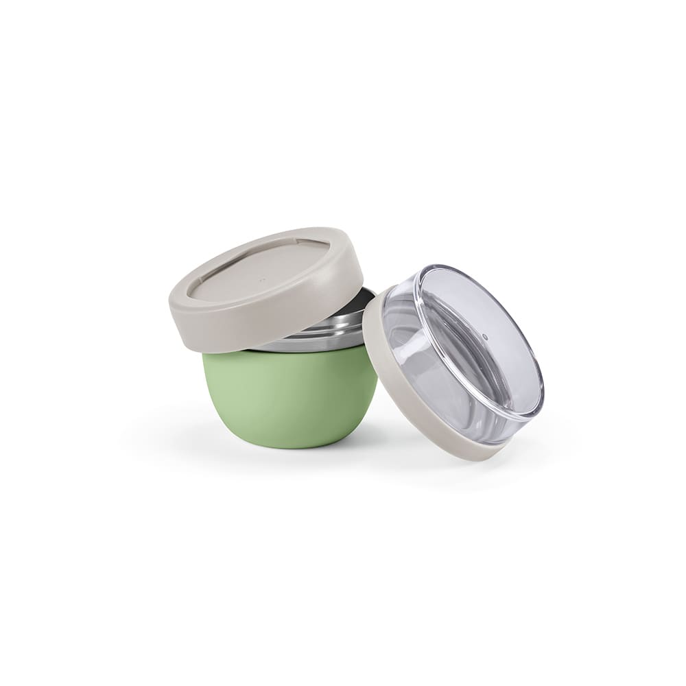 A food flask with two compartments, featuring a soft green outer shell and a clear lid. Includes a branding logo.