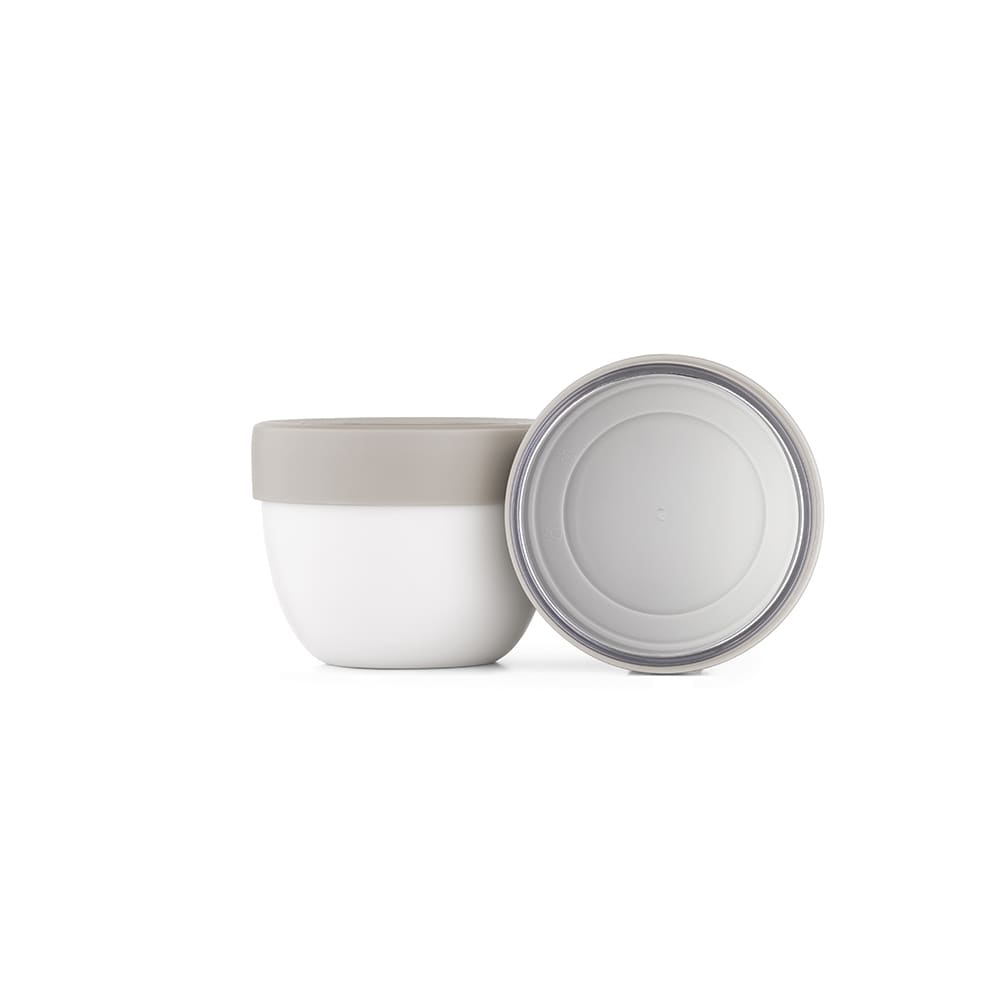A food flask with two compartments, featuring a white base and a grey lid. It has a circular bottom design and includes a logo.