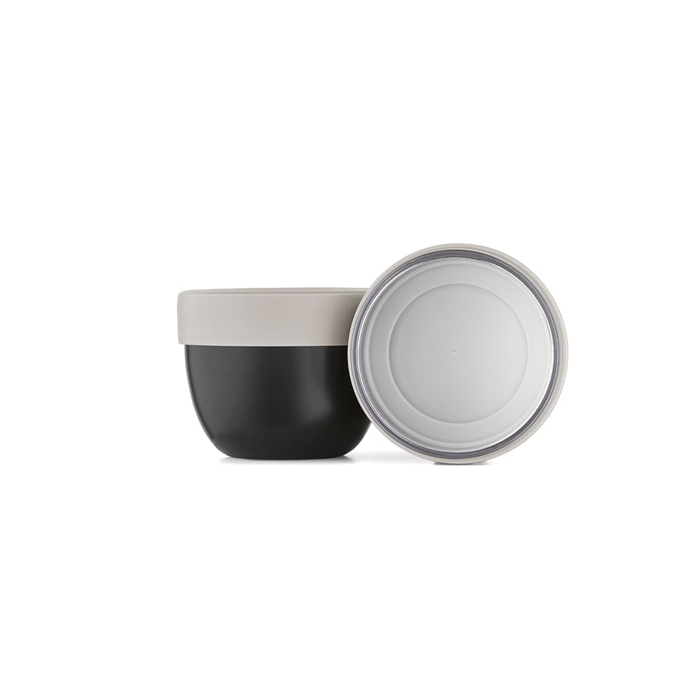 A food flask with two compartments, featuring a matte black body and a light beige lid. It has a logo on the side.