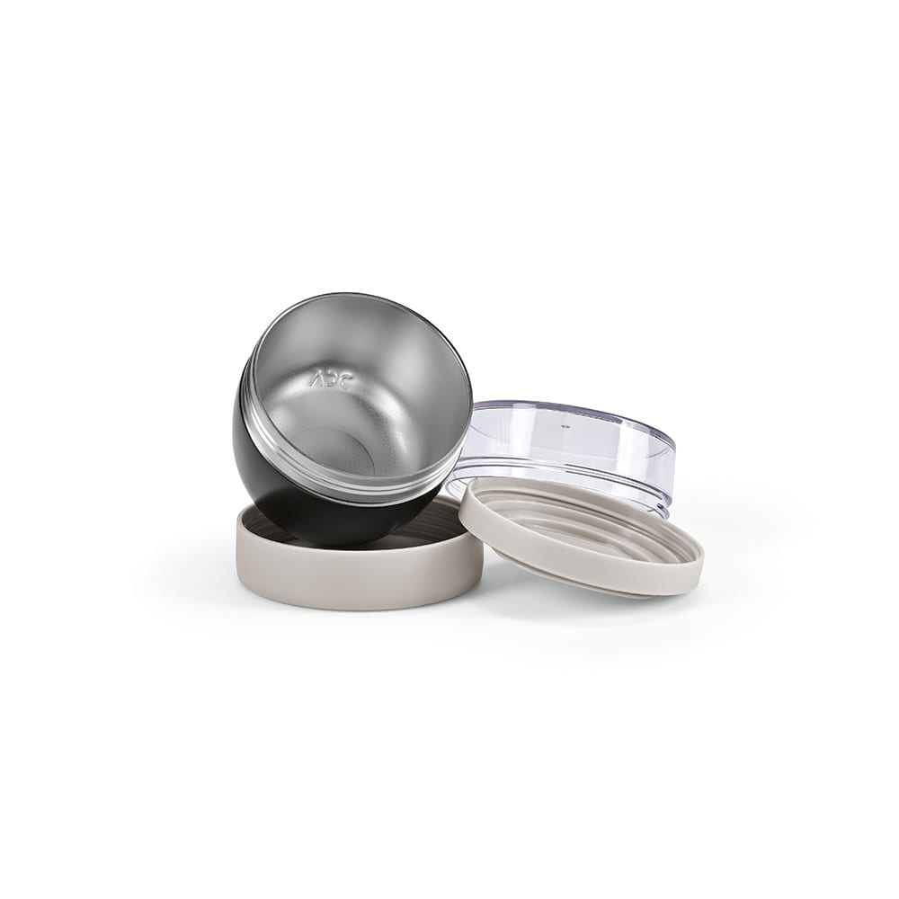 A food flask in black and silver with a clear lid and a beige base, featuring two compartments.
