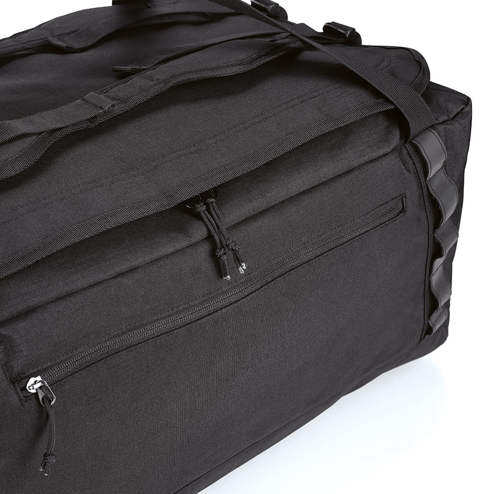 A black gym bag featuring reflective strips and a zippered pocket. It has an adjustable strap and a durable design.