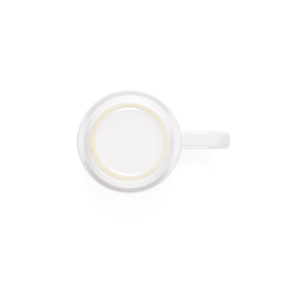 A ceramic mug with a white body and a cork lid and base. Features a handle and a subtle logo.