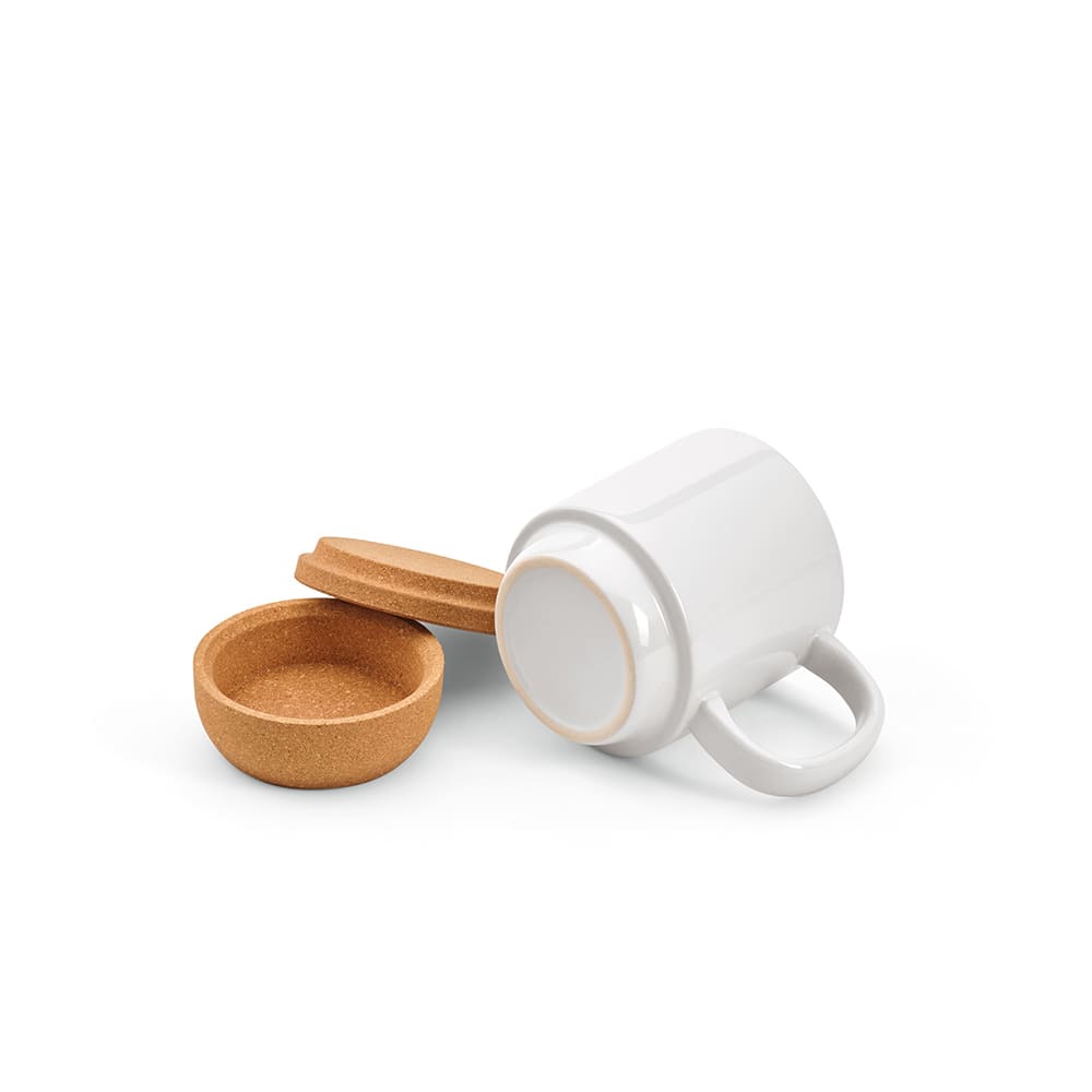 A ceramic mug with a cork lid and base, featuring a white finish and a smooth design.