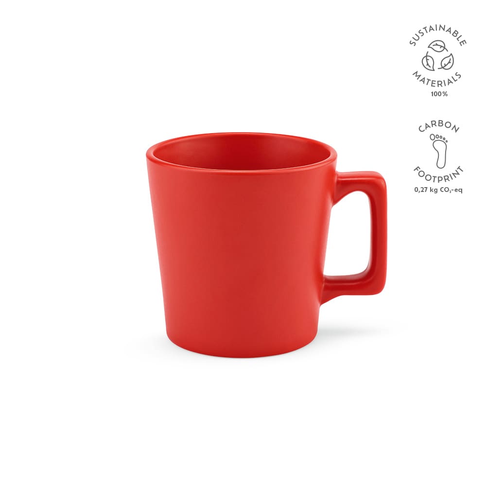 A red ceramic mug with a matt finish, featuring a handle and a compact design. It has a logo on the side.