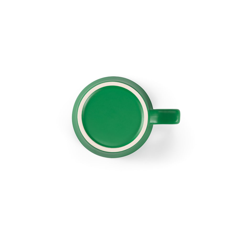 A green ceramic mug with a matt finish, featuring a round base and a handle. It has a simple, sleek design.