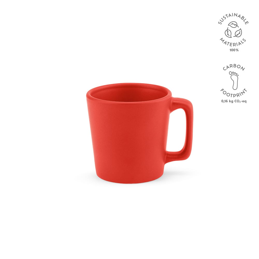 A red ceramic mug with a matt finish and a handle, featuring a logo. Holds 75ml.