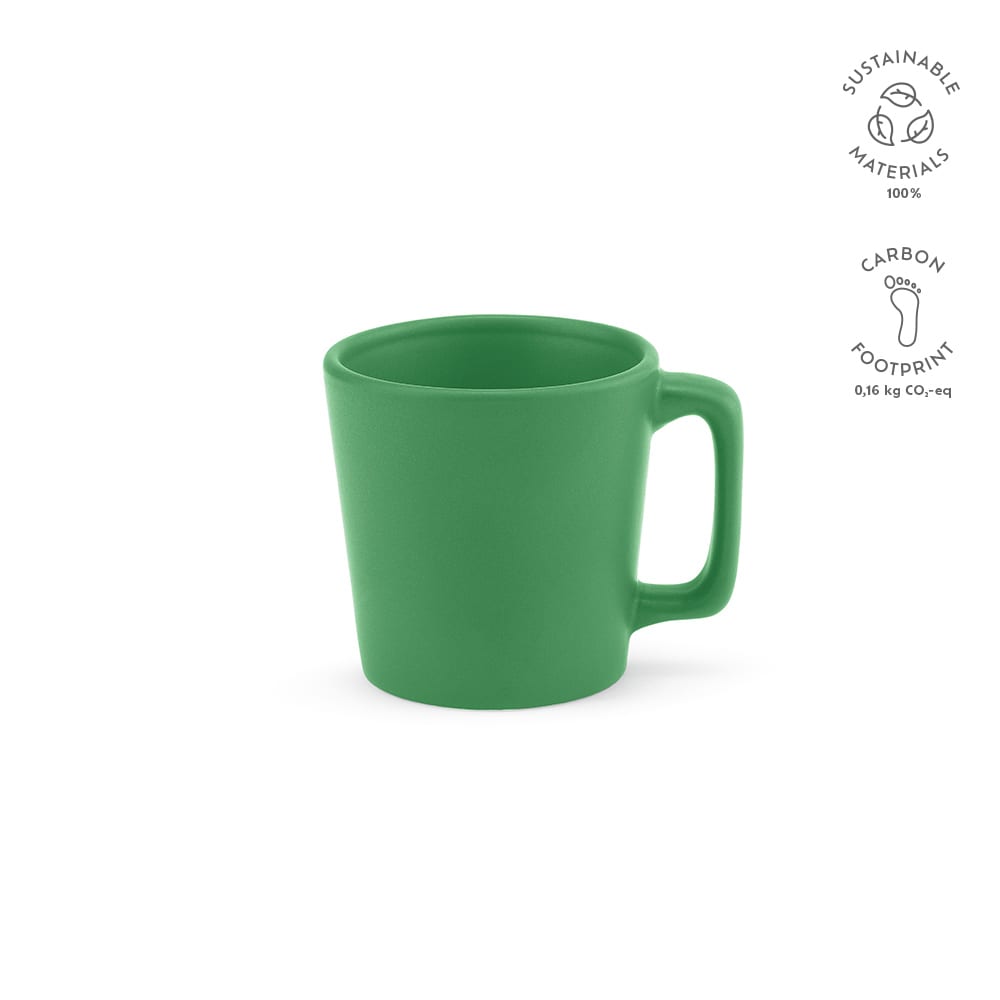 A green ceramic mug with a matt finish and a handle, featuring a logo. The capacity is 75ml.