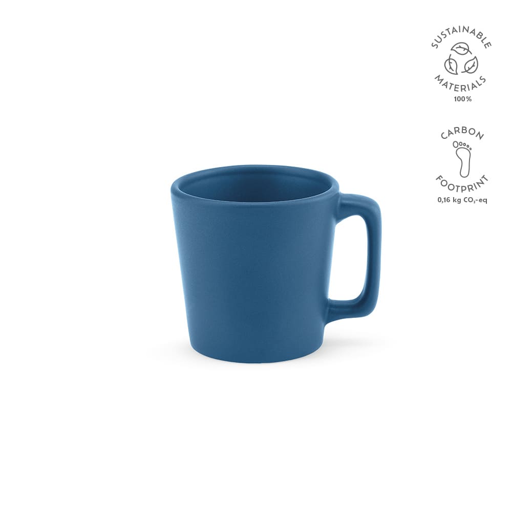 A ceramic mug in a matte blue finish, featuring a handle and a logo. Holds 75ml of liquid.