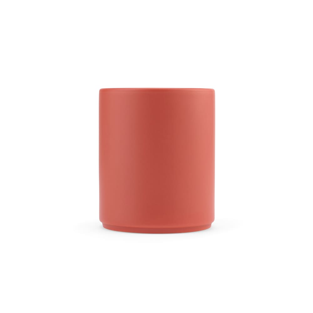 A drink mug in a matte finish, featuring a round shape and a coral colour. It has a logo on its side.