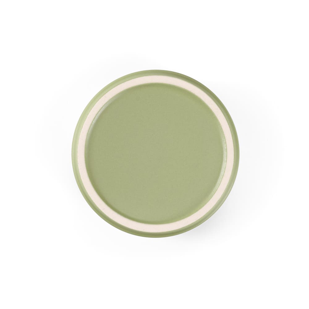 A round ceramic plate in a muted green colour with a contrasting white rim. It has a smooth matte finish.