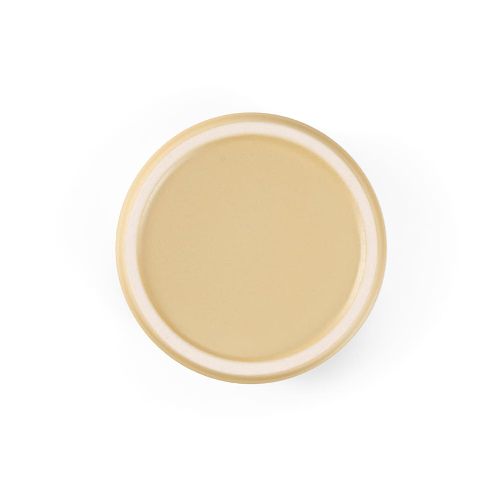 A ceramic mug with a matt finish in a soft beige colour, featuring a simple design and a subtle rim.