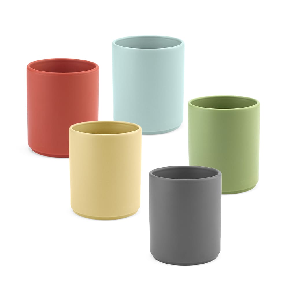 Five ceramic mugs in various colours: red, blue, green, yellow, and grey with a matt finish. Each mug has a rounded shape.