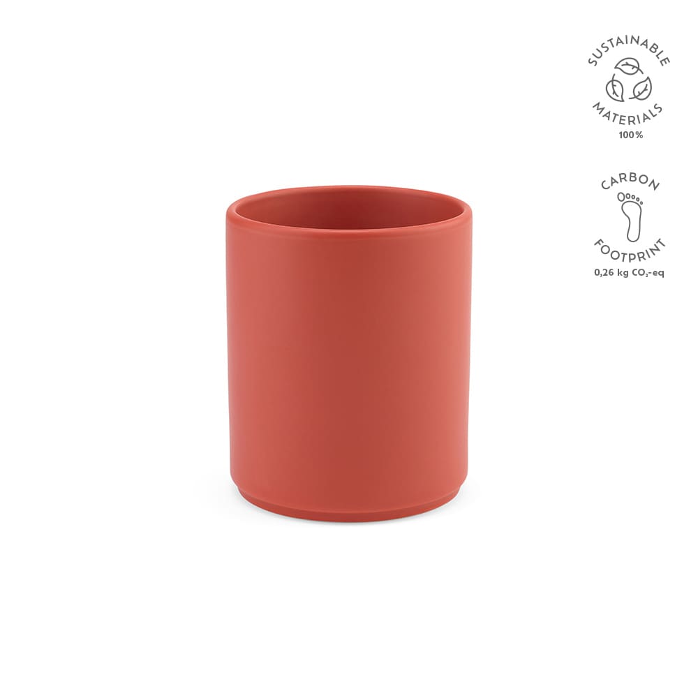 A ceramic mug in a matte terracotta finish, featuring a logo and made from sustainable materials.