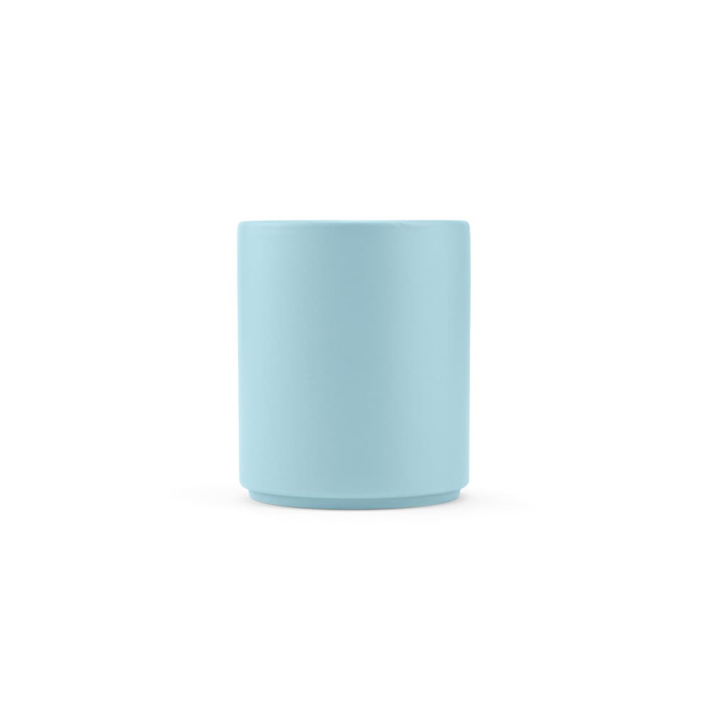 A ceramic mug with a matt finish in light blue, featuring a smooth surface and a rounded design.