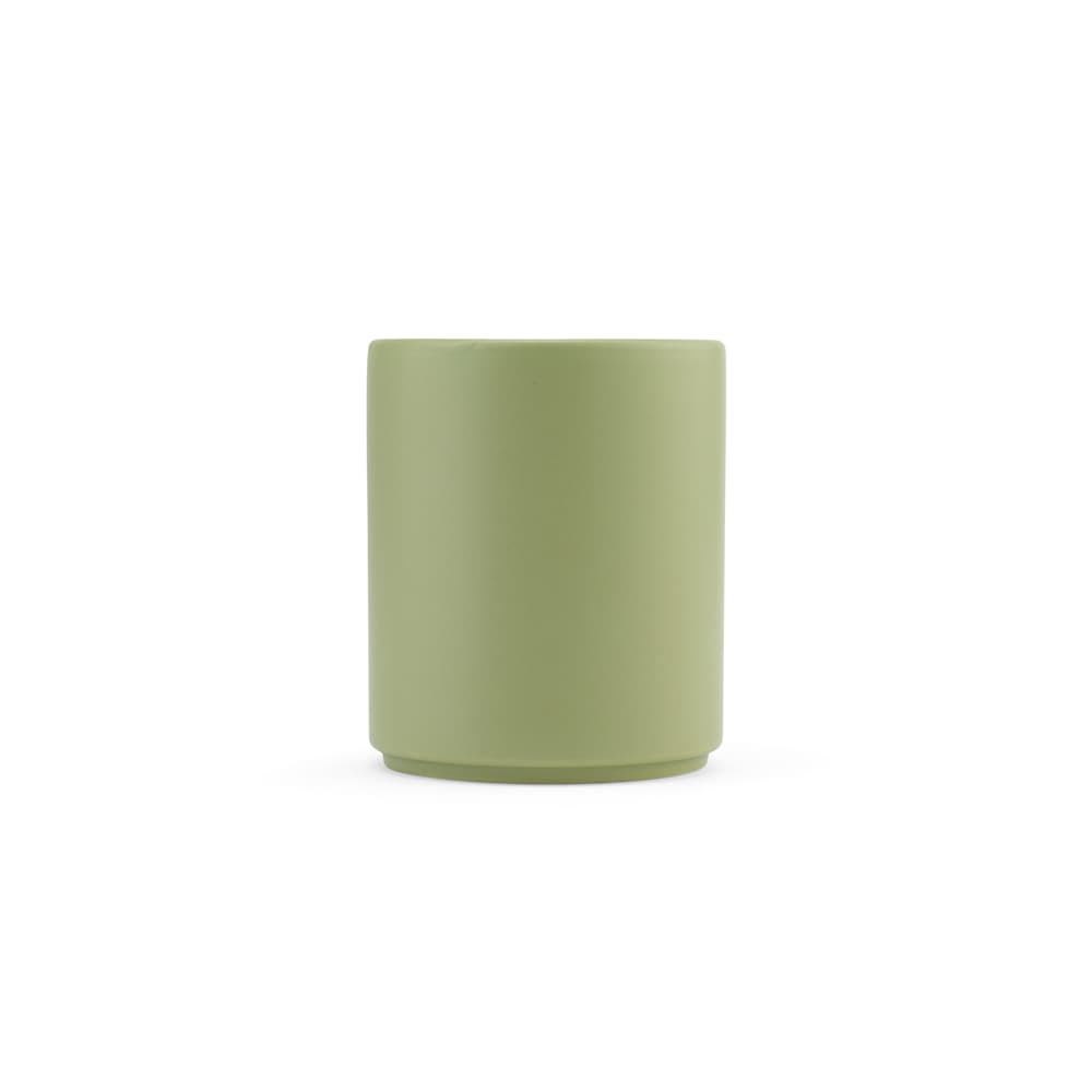 A ceramic mug with a matte finish in a soft green colour, featuring a simple design and a logo.