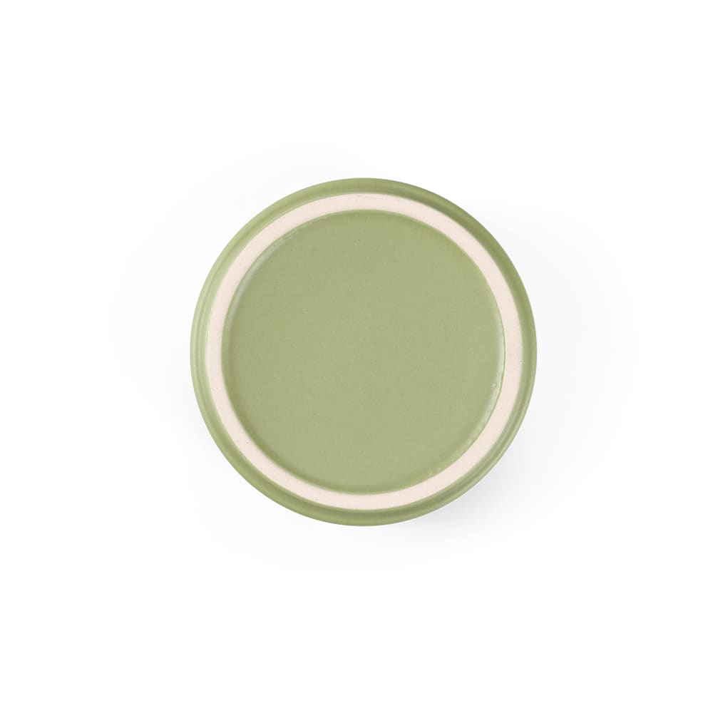 A ceramic plate in green with a cream-coloured rim, featuring a smooth, matte finish.