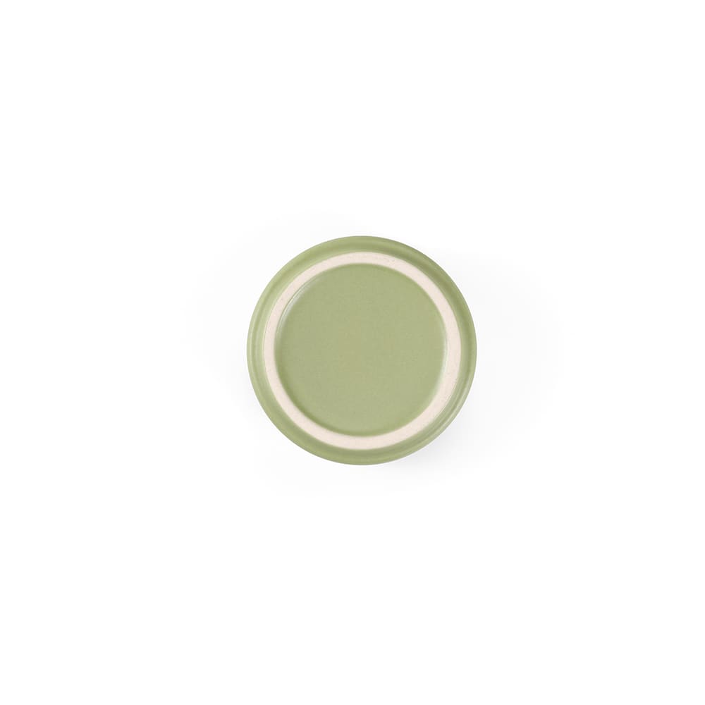 A green ceramic mug with a matt finish and a white rim, featuring a logo on one side.