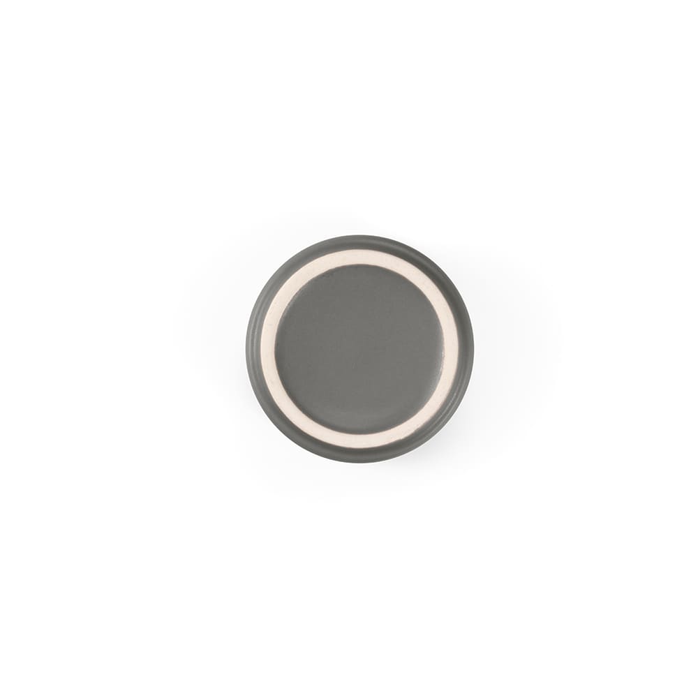 A ceramic plate in dark grey with a light inner rim, featuring a smooth matte finish and a simple design.