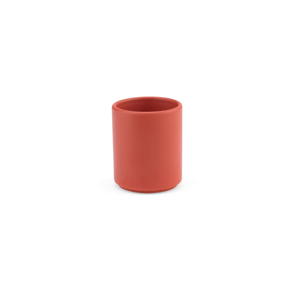 A ceramic mug with a matte finish, featuring a cylindrical shape in a terracotta colour. It has a logo on its surface.