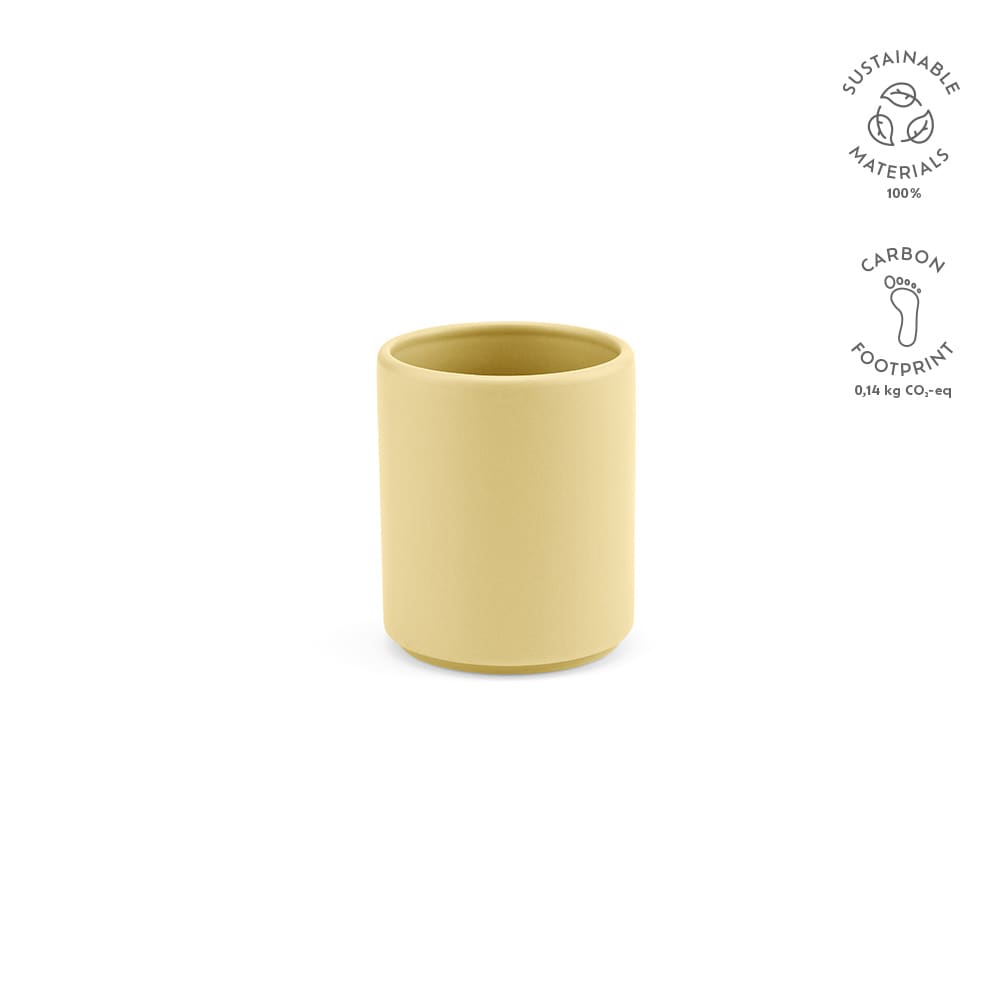 A ceramic mug in a matt finish, featuring a soft yellow colour and a minimalist design. It has a branding logo.