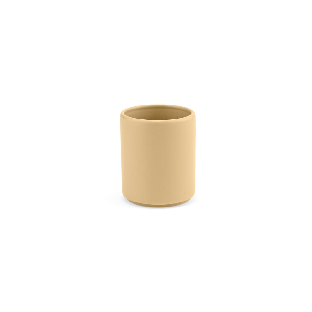 A ceramic mug in a matt finish, featuring a soft beige colour, with a simple, modern design.